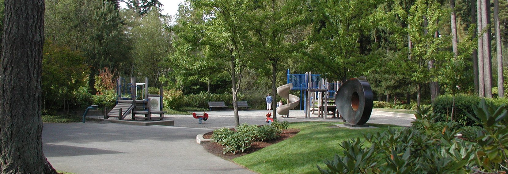 mill creek park with sculpture & playground equipment